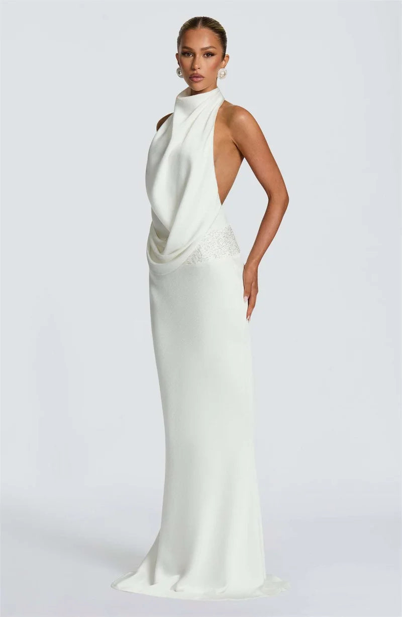 LAURA - שמלת מקסי אלגנטית עם צווארון הולטר, גב פתוח וחגורה מעוטרת