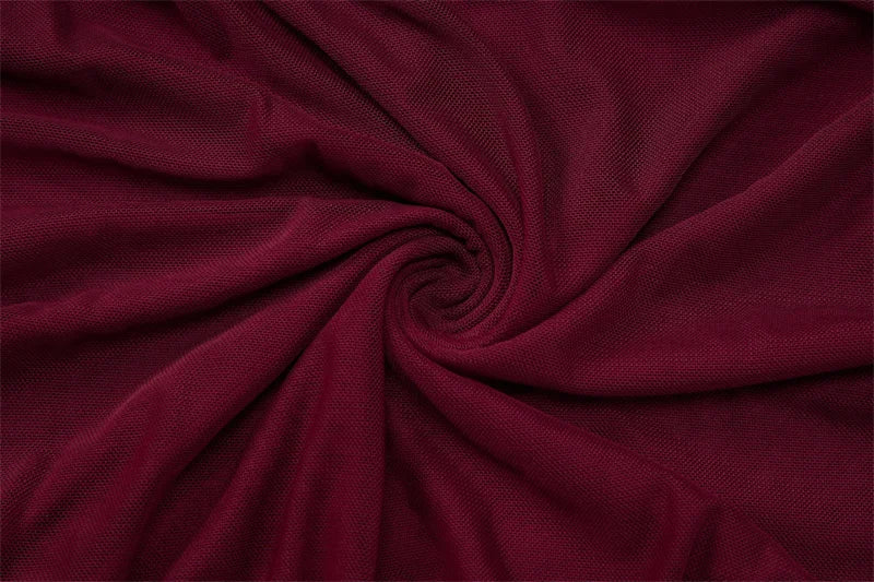 LYRA - שמלת מיני עם צווארון הולטר, מחשוף עמוק, ועיטורי קריסטל